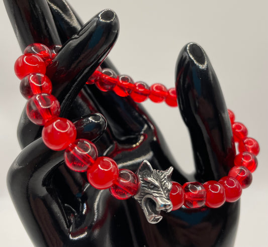 Red glass 8mm bead stretch bracelet with wolf’s head. 7.5”