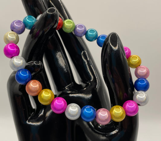 Multicolored metallic pearlized stretch bead bracelet . 6.75”