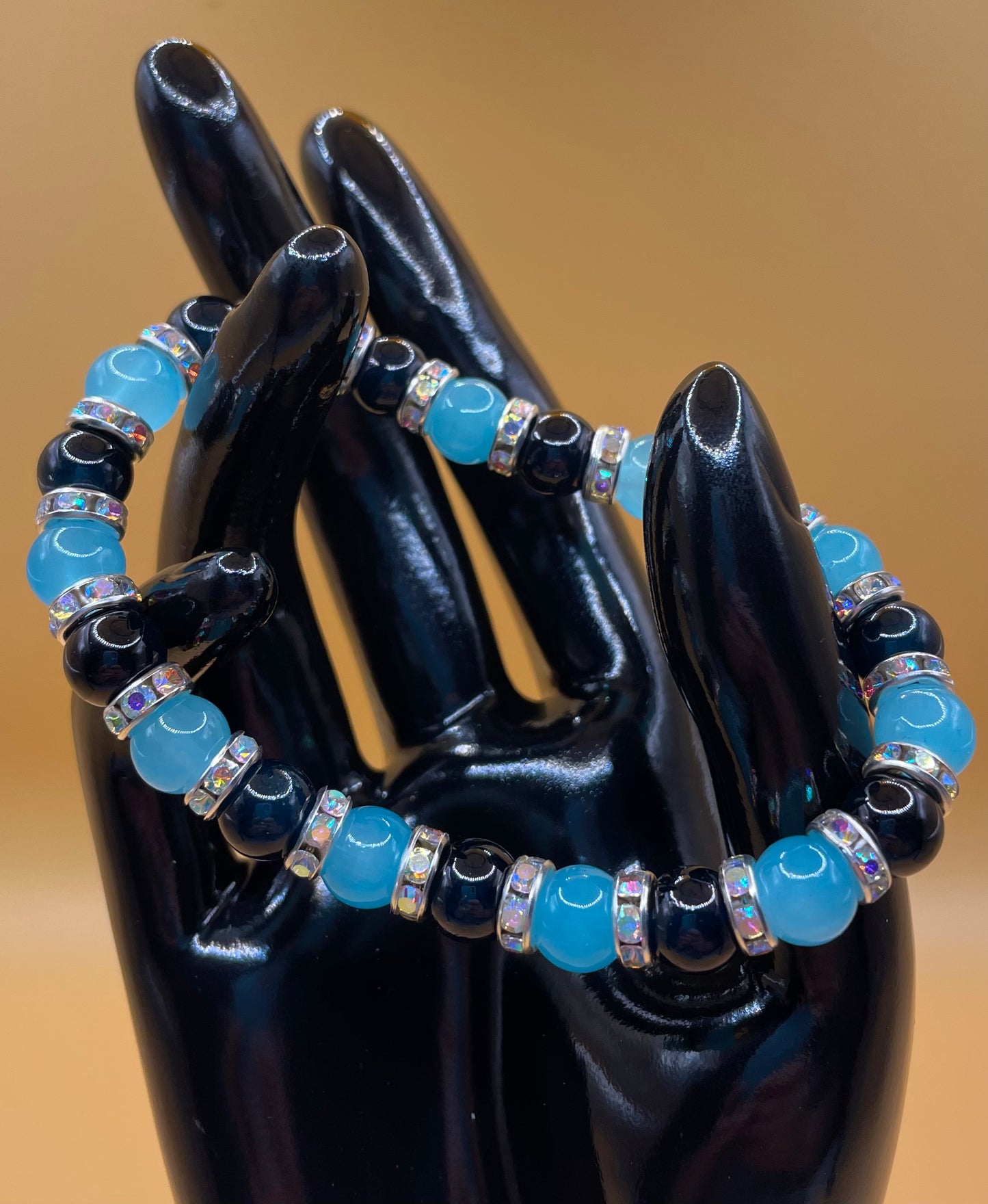 Light and dark blue 8mm glass bead bracelet with rhinestone spacers. 7”