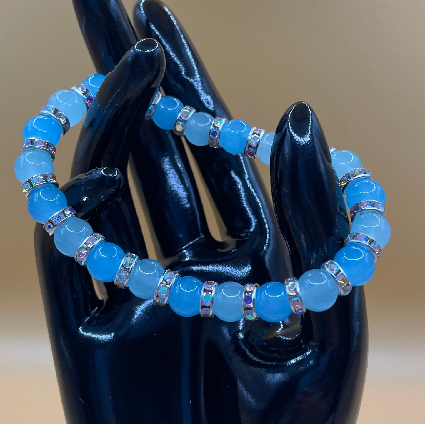 Multi blue 8mm glass bead bracelet with rhinestone spacers. 6.75”